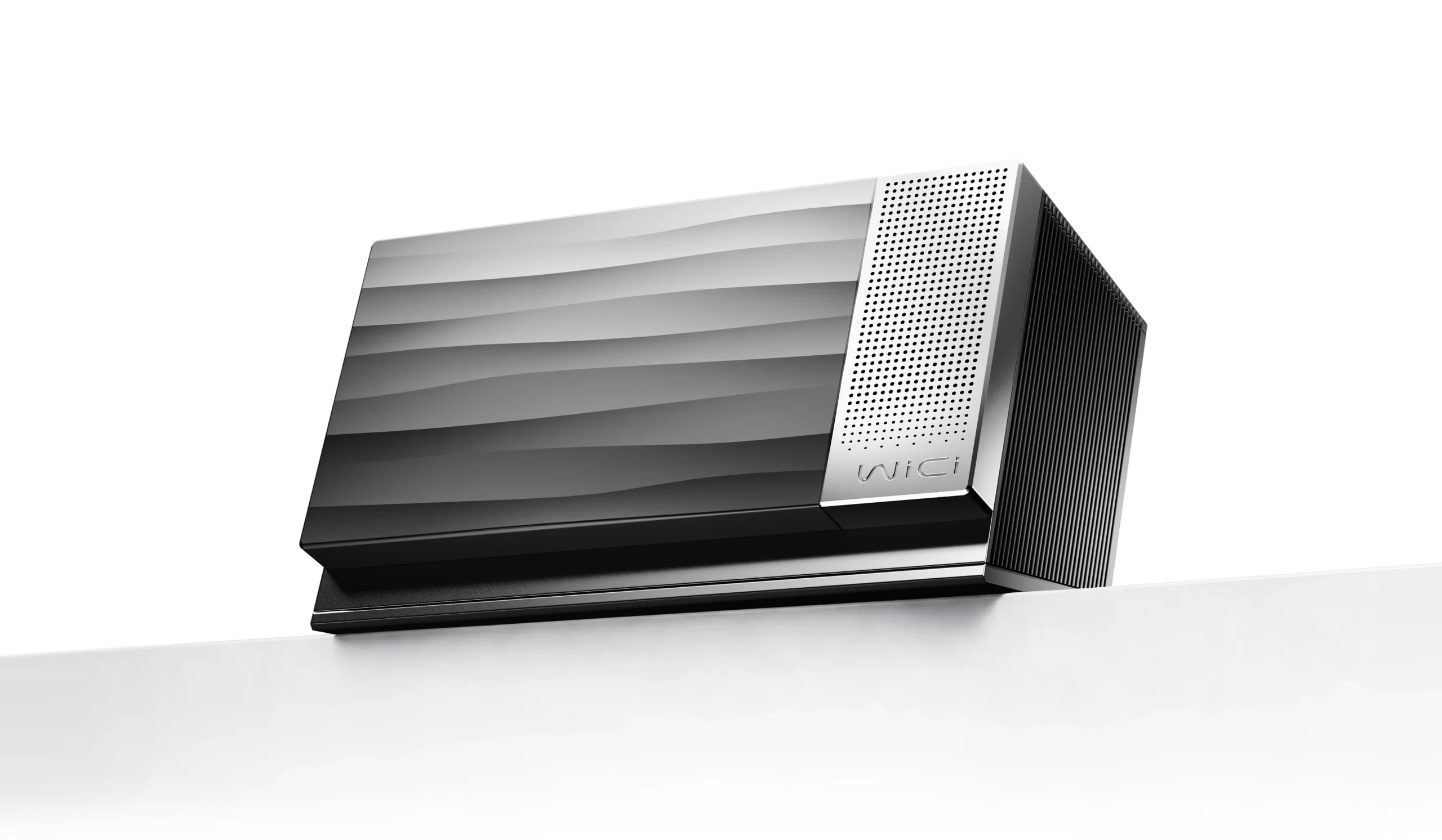 Le boîtier WiCi One, eGPU sans fil en Wi-Fi 7, posé sur un rebord blanc